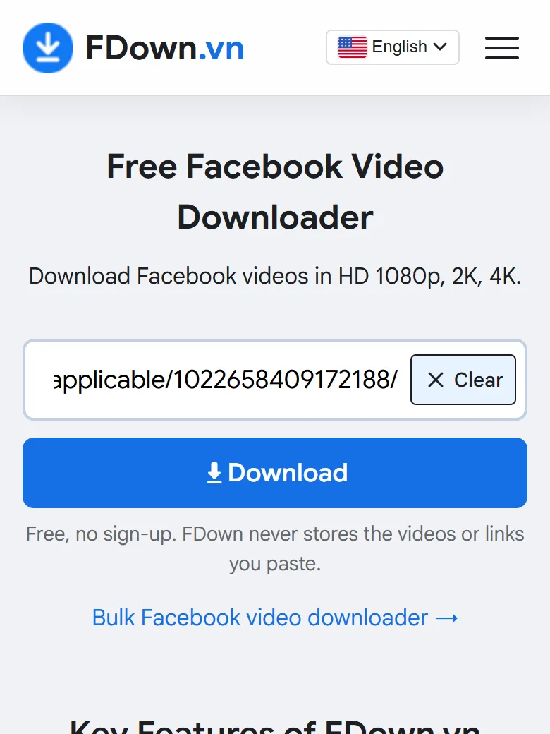 A Facebook video link pasted into the downloader box on a phone before tapping Download